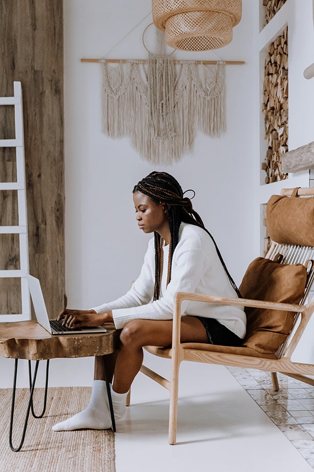 A african american young girl sitted and working with her leptop